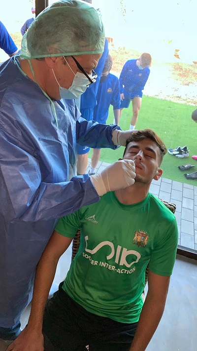 third division player taking COVID test
