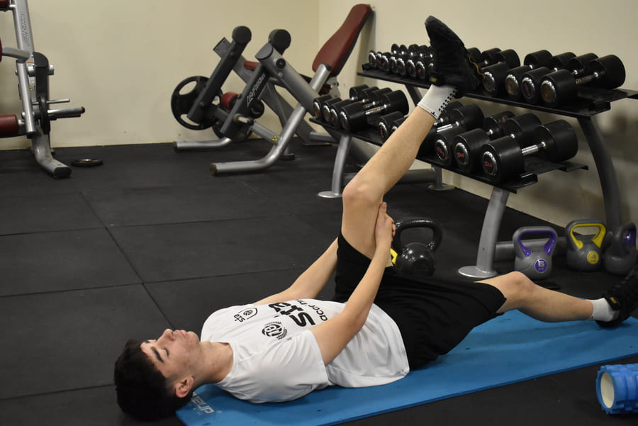 Top 6 stretching routines that prevent common football injuries.