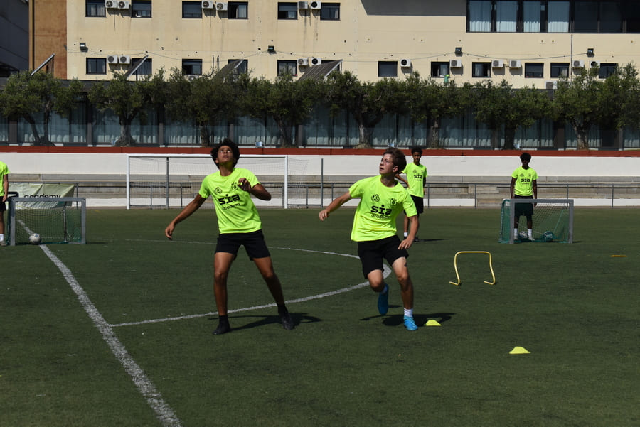 How does a summer football camp become effective for a player.